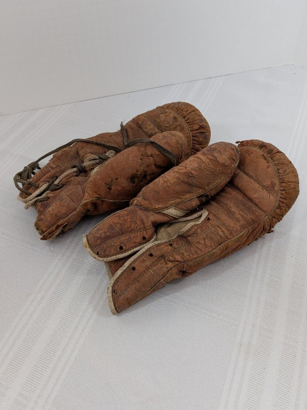 Pair of antique suede and horsehair boxing gloves 1940s